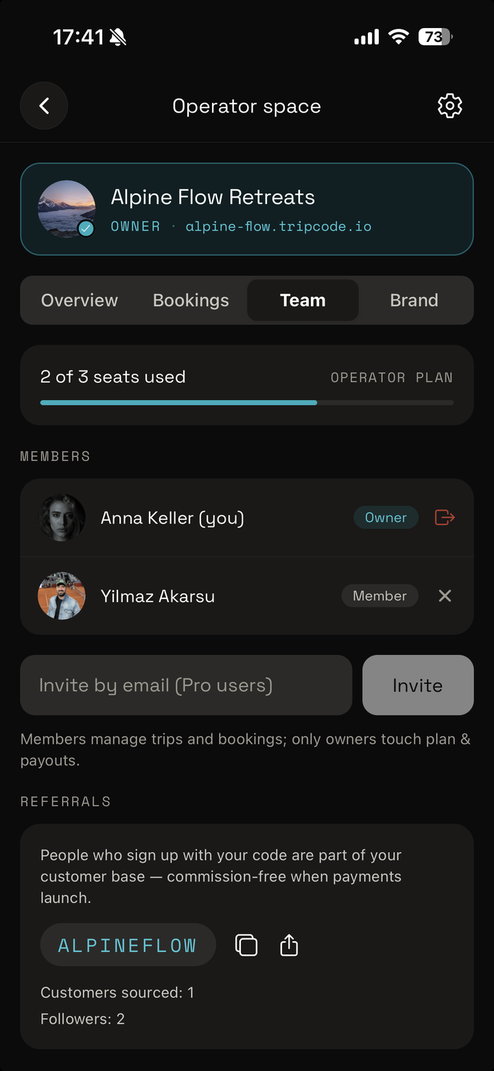 The team screen — seats, members, invites and your referral code.